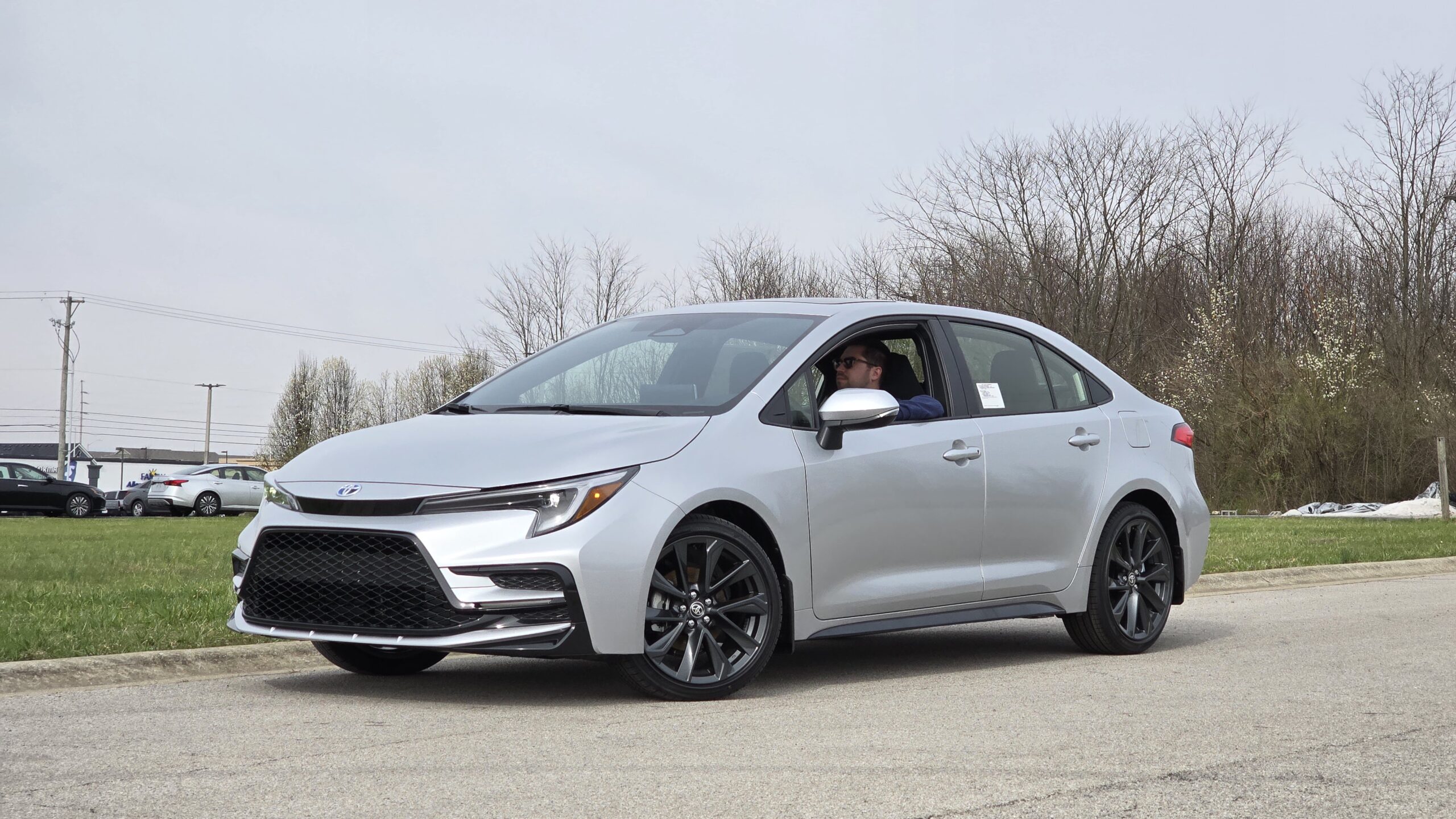 Front driver side angle of the 2026 Toyota Corolla showing the aggressive lower front grille and LED headlights.