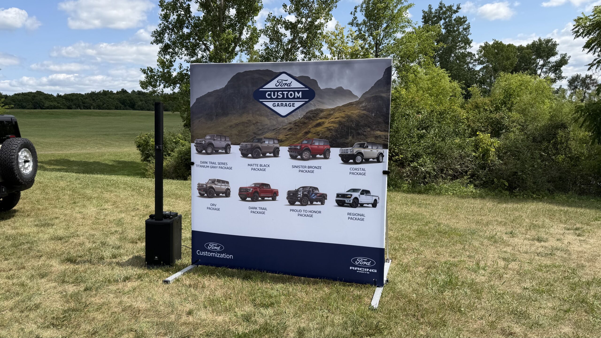Ford Custom Garage banner set up on outdoor grass field