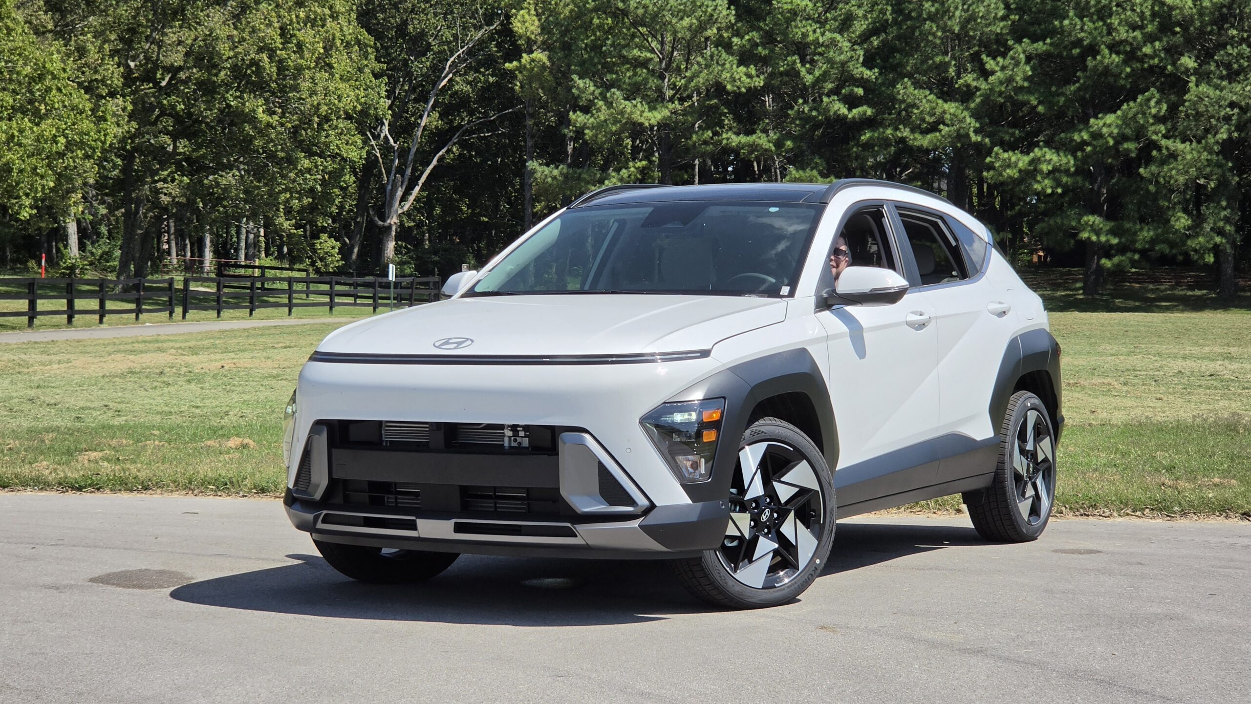 Front three-quarter exterior view of the 2027 Hyundai Kona in white parked outdoors.
